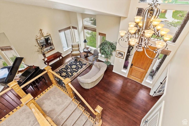 14248 Tumbleweed Way, Draper, UT 84020 - foyer with a towering ceiling, a chandelier, wood finished floors, and baseboards