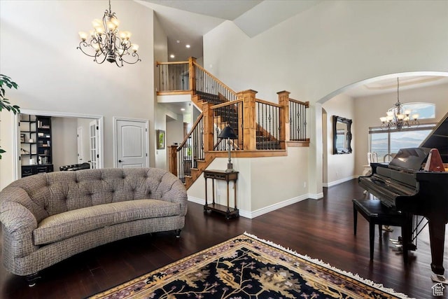 14248 Tumbleweed Way, Draper, UT 84020 - living area with a chandelier, wood finished floors, arched walkways, a towering ceiling, and stairway