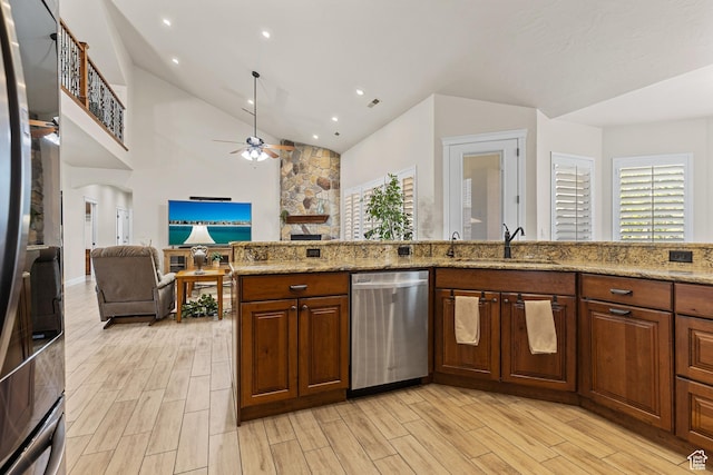 880 N 370 W, La Verkin, UT 84745 - kitchen featuring dishwasher, a sink, light wood-style flooring, ceiling fan, and high vaulted ceiling