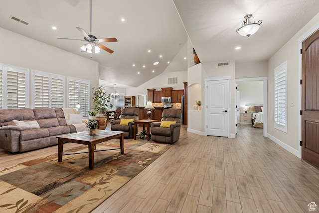 880 N 370 W, La Verkin, UT 84745 - living area with ceiling fan, light wood-style flooring, high vaulted ceiling, a chandelier, and baseboards