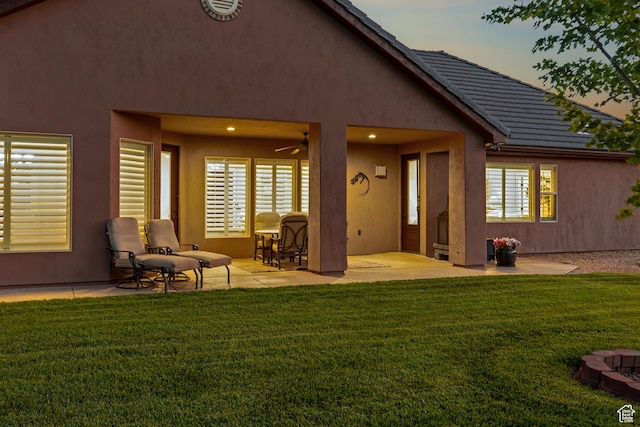 880 N 370 W, La Verkin, UT 84745 - back of house featuring a patio, a lawn, a ceiling fan, and stucco siding