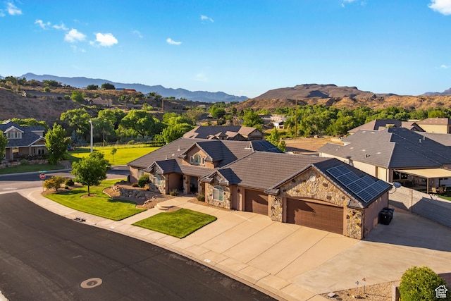 880 N 370 W, La Verkin, UT 84745 - ranch-style house featuring stone siding, a mountain view, an attached garage, driveway, and a tiled roof