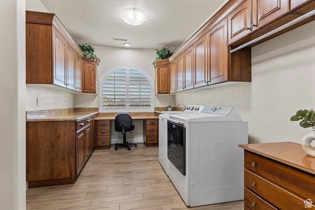 880 N 370 W, La Verkin, UT 84745 - laundry area featuring washing machine and clothes dryer, cabinet space, a desk, light wood-type flooring, and a textured ceiling
