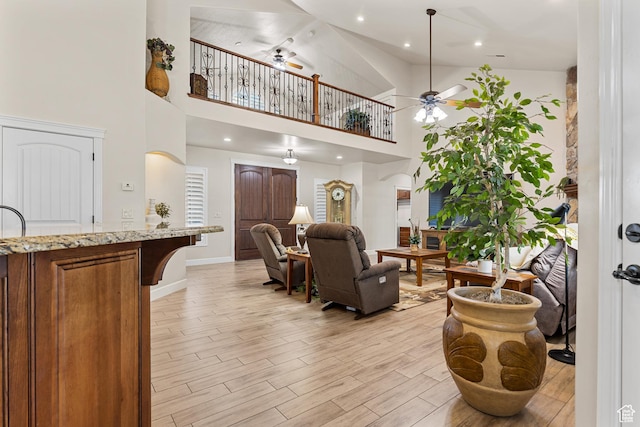 880 N 370 W, La Verkin, UT 84745 - living room with ceiling fan, high vaulted ceiling, light wood-style flooring, baseboards, and recessed lighting