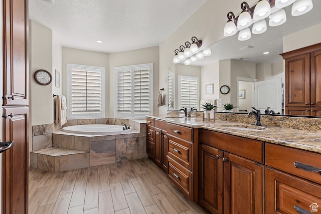 880 N 370 W, La Verkin, UT 84745 - bathroom with a garden tub, double vanity, and wood finished floors