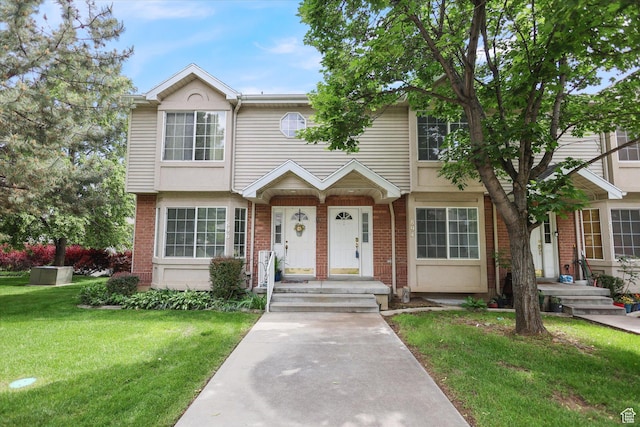 894 N Main St Unit 13, Orem, UT 84057 - view of property with brick siding and a front yard