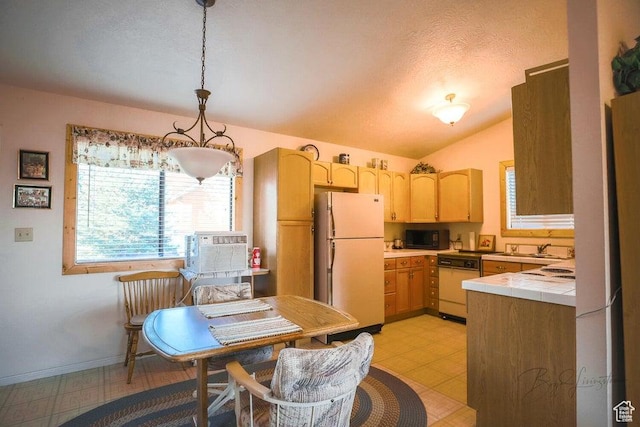 349 W 100 N, Pine Valley, UT 84781 - kitchen featuring white appliances, tile counters, vaulted ceiling, light brown cabinetry, and light flooring
