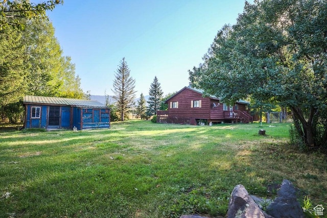 349 W 100 N, Pine Valley, UT 84781 - view of grassy yard featuring an outbuilding and a wooden deck
