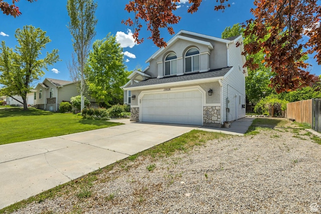 13928 S Ben Lomond Peak Dr W, Riverton, UT 84096 - view of front of home with concrete driveway, a garage, and stone siding