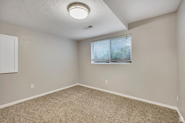 13928 S Ben Lomond Peak Dr W, Riverton, UT 84096 - empty room featuring carpet, a textured ceiling, and baseboards