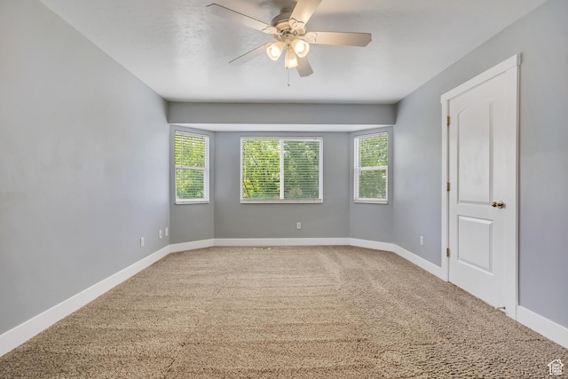 13928 S Ben Lomond Peak Dr W, Riverton, UT 84096 - carpeted empty room featuring plenty of natural light, baseboards, and ceiling fan