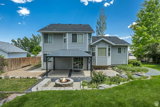 13928 S Ben Lomond Peak Dr W, Riverton, UT 84096 - back of house featuring an outdoor fire pit and a patio area