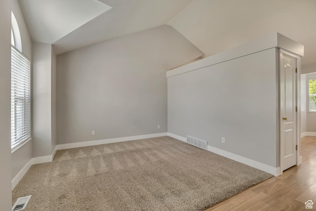 13928 S Ben Lomond Peak Dr W, Riverton, UT 84096 - additional living space featuring vaulted ceiling, baseboards, and light wood finished floors
