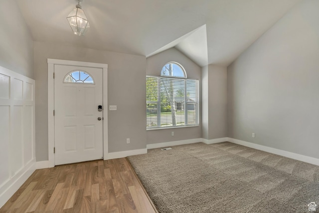 13928 S Ben Lomond Peak Dr W, Riverton, UT 84096 - entrance foyer featuring lofted ceiling, wood finished floors, and baseboards