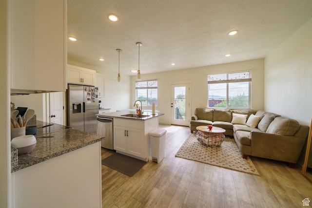 988 E 1300 S, Provo, UT 84606 - kitchen featuring stainless steel appliances, a sink, light wood finished floors, white cabinetry, and recessed lighting