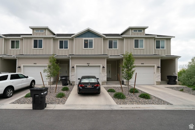 988 E 1300 S, Provo, UT 84606 - townhome / multi-family property featuring a garage, board and batten siding, and driveway