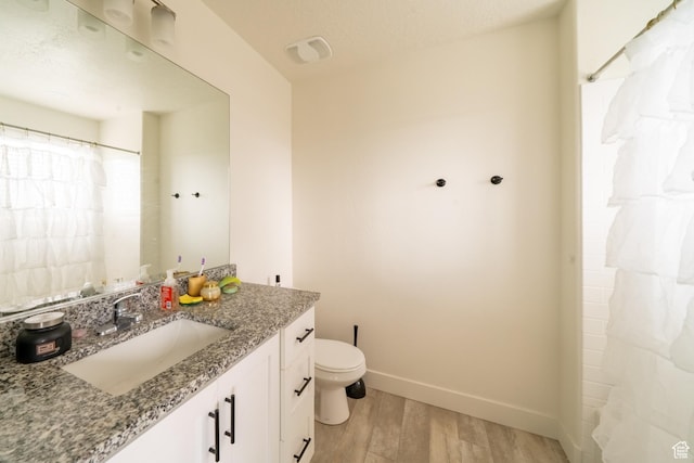988 E 1300 S, Provo, UT 84606 - full bathroom with wood finished floors, vanity, toilet, and baseboards