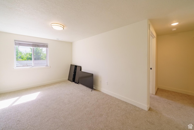 988 E 1300 S, Provo, UT 84606 - empty room with light colored carpet, baseboards, a textured ceiling, and a smoke detector