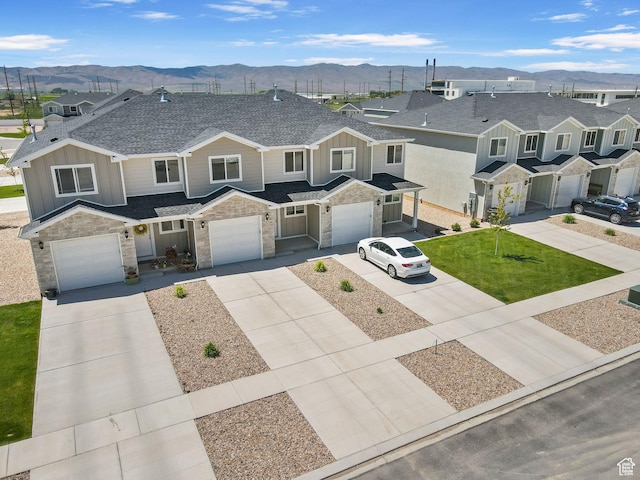 917 N 100 W, Nephi, UT 84648 - multi unit property featuring a mountain view, board and batten siding, driveway, stone siding, and an attached garage