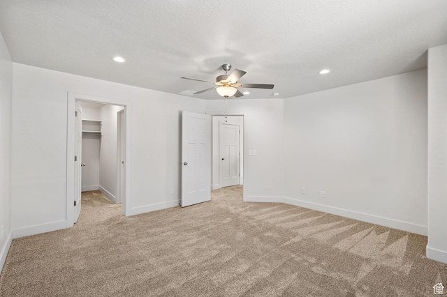 917 N 100 W, Nephi, UT 84648 - unfurnished bedroom with light carpet, baseboards, recessed lighting, a walk in closet, and a ceiling fan
