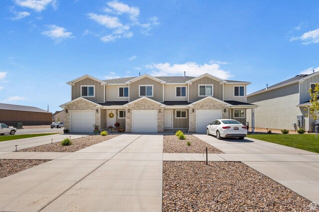 917 N 100 W, Nephi, UT 84648 - multi unit property featuring driveway, board and batten siding, an attached garage, and stone siding
