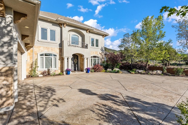 2204 N Bridge Water Rd, Cedar City, UT 84721 - view of front of house featuring a balcony and stucco siding