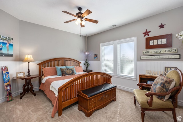 2204 N Bridge Water Rd, Cedar City, UT 84721 - bedroom with wainscoting, light colored carpet, and ceiling fan