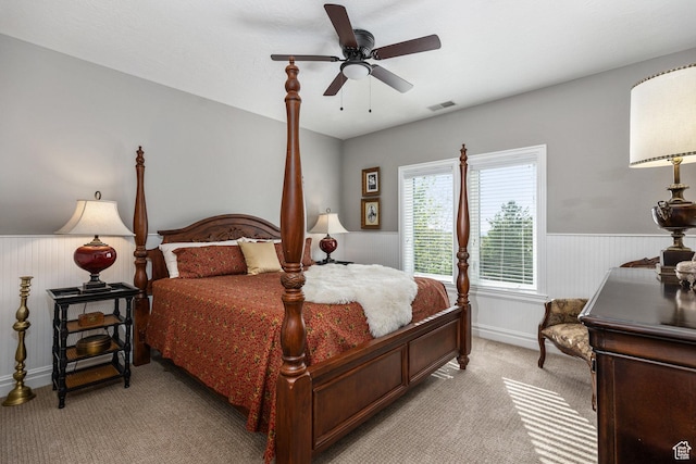 2204 N Bridge Water Rd, Cedar City, UT 84721 - bedroom featuring light carpet, wainscoting, baseboards, and a ceiling fan
