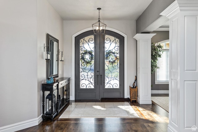 2204 N Bridge Water Rd, Cedar City, UT 84721 - entrance foyer featuring arched walkways, french doors, wood finished floors, and a chandelier
