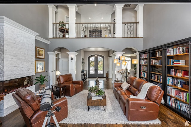 2204 N Bridge Water Rd, Cedar City, UT 84721 - living area with ornate columns, arched walkways, wood finished floors, french doors, and a high ceiling