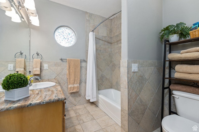 2204 N Bridge Water Rd, Cedar City, UT 84721 - bathroom with tile walls, toilet, vanity, tile patterned floors, and shower / tub combo with curtain