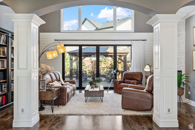 2204 N Bridge Water Rd, Cedar City, UT 84721 - living room with decorative columns, arched walkways, wood finished floors, and plenty of natural light