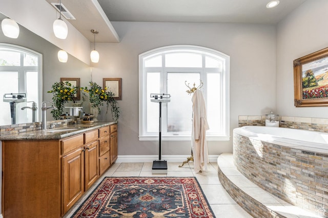2204 N Bridge Water Rd, Cedar City, UT 84721 - full bathroom with vanity, a garden tub, baseboards, and tile patterned floors