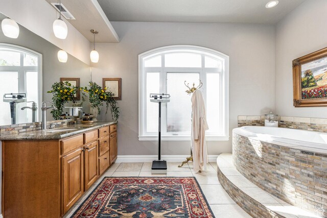 2204 N Bridge Water Rd, Cedar City, UT 84721 - full bath featuring vanity, a bath, baseboards, and tile patterned flooring