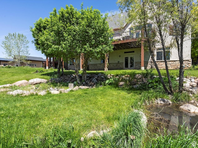 5577 E Elkhorn Dr, Eden, UT 84310 - view of green lawn with french doors and a wooden deck