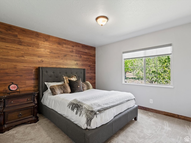 5577 E Elkhorn Dr, Eden, UT 84310 - bedroom featuring wood walls, carpet flooring, and baseboards
