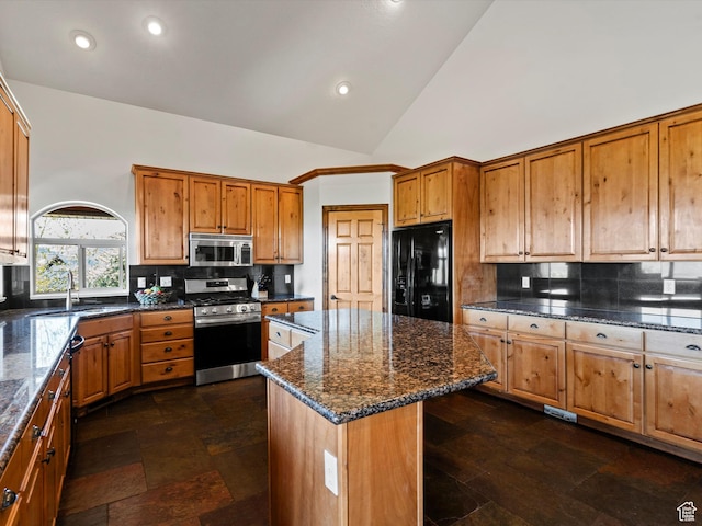 5577 E Elkhorn Dr, Eden, UT 84310 - kitchen featuring stainless steel appliances, a kitchen island, backsplash, dark stone countertops, and recessed lighting