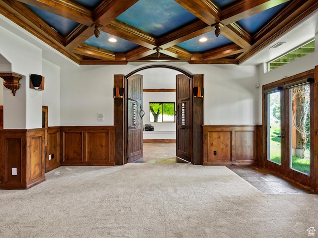 5577 E Elkhorn Dr, Eden, UT 84310 - unfurnished room with carpet floors, beam ceiling, wainscoting, coffered ceiling, and a decorative wall