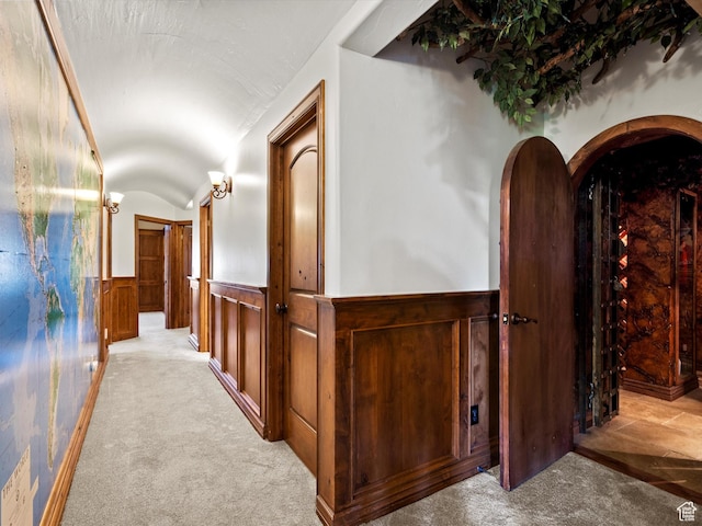 5577 E Elkhorn Dr, Eden, UT 84310 - hallway featuring a wainscoted wall, carpet flooring, and vaulted ceiling