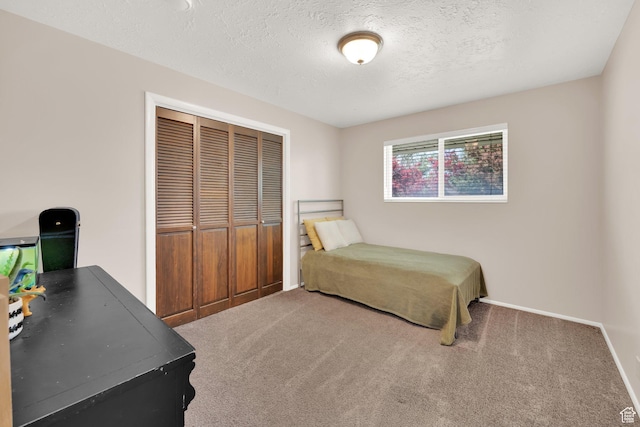 1607 Mountain Cir, Fruit Heights, UT 84037 - bedroom featuring carpet flooring, a closet, a textured ceiling, and baseboards