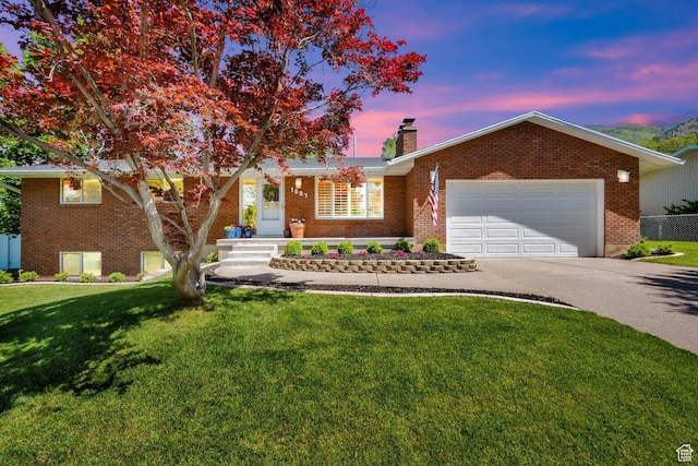 1607 Mountain Cir, Fruit Heights, UT 84037 - view of front of house with concrete driveway, brick siding, a chimney, and a garage