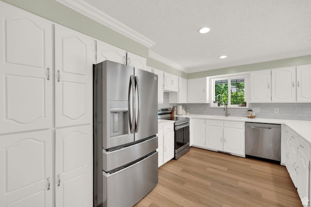 1607 Mountain Cir, Fruit Heights, UT 84037 - kitchen featuring stainless steel appliances, ornamental molding, a sink, a textured ceiling, and white cabinets