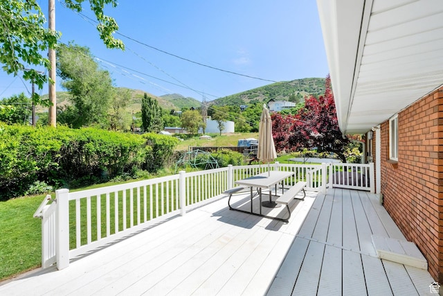 1607 Mountain Cir, Fruit Heights, UT 84037 - wooden deck with a mountain view, a lawn, and outdoor dining space