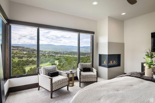 942 N Explorer Peak Dr Unit 420, Heber City, UT 84032 - carpeted bedroom with a mountain view, a glass covered fireplace, and recessed lighting