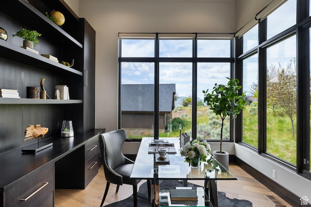 942 N Explorer Peak Dr Unit 420, Heber City, UT 84032 - office area featuring healthy amount of natural light, light wood finished floors, and built in shelves