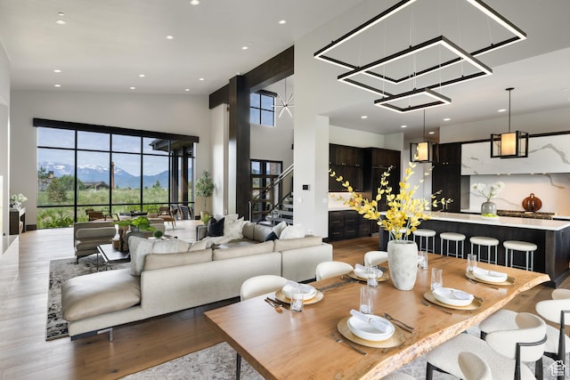 942 N Explorer Peak Dr Unit 420, Heber City, UT 84032 - dining area featuring wood finished floors, a mountain view, stairway, and recessed lighting