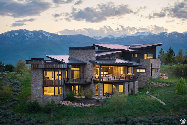 942 N Explorer Peak Dr Unit 420, Heber City, UT 84032 - back of property at dusk with a mountain view and stone siding
