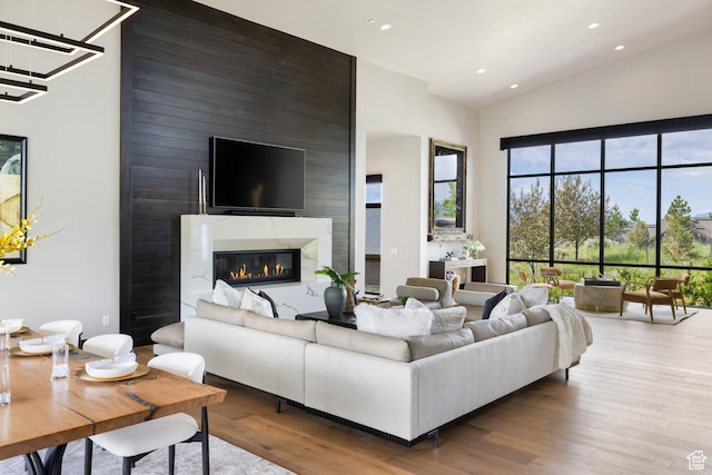 942 N Explorer Peak Dr Unit 420, Heber City, UT 84032 - living area with wood finished floors, recessed lighting, high vaulted ceiling, and a fireplace