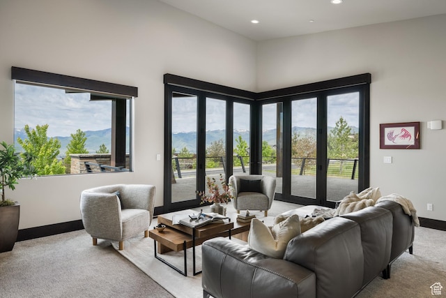 942 N Explorer Peak Dr Unit 420, Heber City, UT 84032 - living room with light colored carpet, a mountain view, baseboards, and recessed lighting