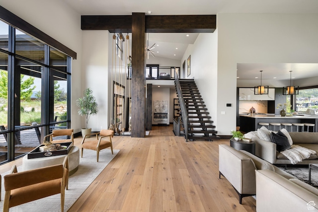 942 N Explorer Peak Dr Unit 420, Heber City, UT 84032 - living room with high vaulted ceiling, stairway, light wood-style flooring, beamed ceiling, and recessed lighting